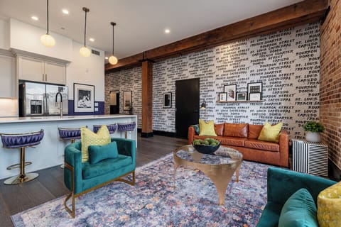 Relax in the living area with a smart TV, stylish seating, and a sleeper sofa for extra guests. Perfect for families or group stays in New Orleans, this inviting space is ideal for movie nights or recharging after a day in the city.