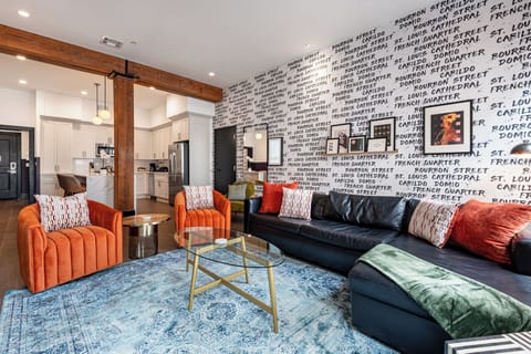 Relax in the living area with a smart TV, stylish seating, and a queen-sized sleeper sofa for extra guests. Perfect for families or group stays in New Orleans, this inviting space is ideal for movie nights or recharging after a day in the city.