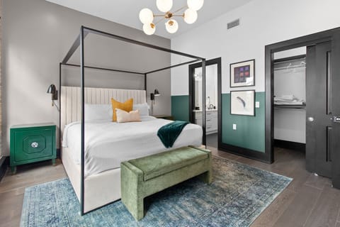 Retreat to the Primary bedroom with a plush king bed, walk-in closet, blackout shades, and a smart TV. Designed for comfort and privacy, this suite is perfect for recharging after a day exploring New Orleans.