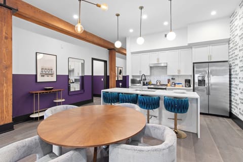 Enjoy meals together at your in-suite dining table with seating for your group. Whether it's takeout, delivery, or a home-cooked meal, this cozy dining area makes every stay at 888 Baronne feel like home in New Orleans.