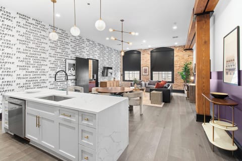 Cook or snack in style with a full kitchen featuring GE stainless appliances, cookware, and an island with bar seating. Ideal for short or extended stays, our kitchens make group travel in New Orleans easy and comfortable.