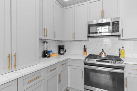 Cook or snack in style with a full kitchen featuring GE stainless appliances, cookware, and an island with bar seating. Ideal for short or extended stays, our kitchens make group travel in New Orleans easy and comfortable.