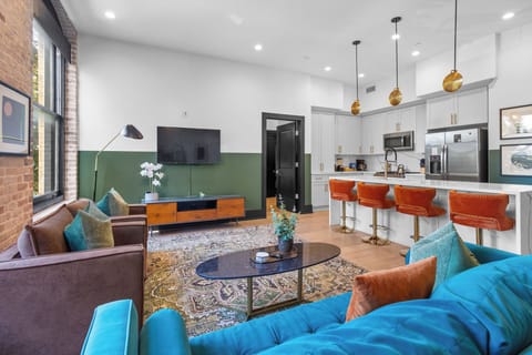Relax in the living area with a smart TV, stylish seating and a sleeper sofa for extra guests. Perfect for families or group stays in New Orleans, this inviting space is ideal for movie nights or recharging after a day in the city.