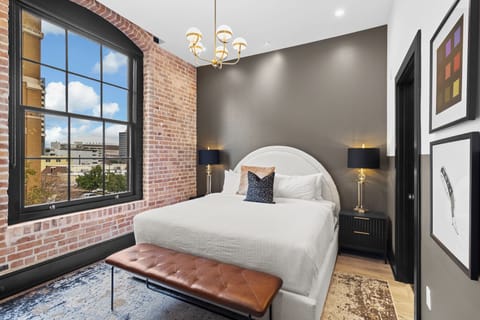 Retreat to the Primary bedroom with a plush king bed, walk-in closet, blackout shades, and a smart TV. Designed for comfort and privacy, this suite is perfect for recharging after a day exploring New Orleans.