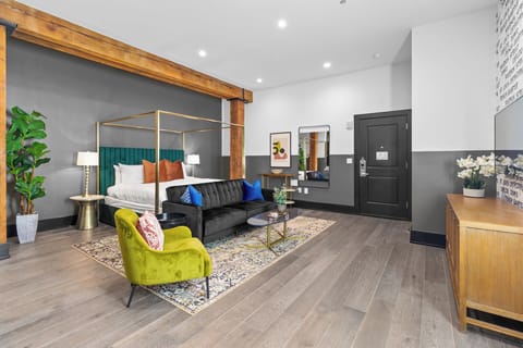 Relax in the living area with a smart TV, stylish seating, and a sleeper sofa for extra guests. Perfect for families or group stays in New Orleans, this inviting space is ideal for movie nights or recharging after a day in the city.