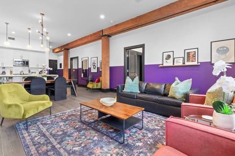 Relax in the living area with a smart TV, stylish seating, and a sleeper sofa for extra guests. Perfect for families or group stays in New Orleans, this inviting space is ideal for movie nights or recharging after a day in the city.