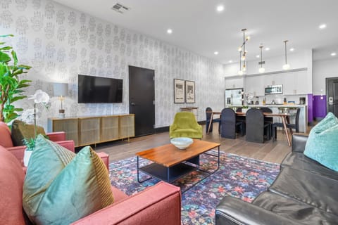 Relax in the living area with a smart TV, stylish seating, and a sleeper sofa for extra guests. Perfect for families or group stays in New Orleans, this inviting space is ideal for movie nights or recharging after a day in the city.