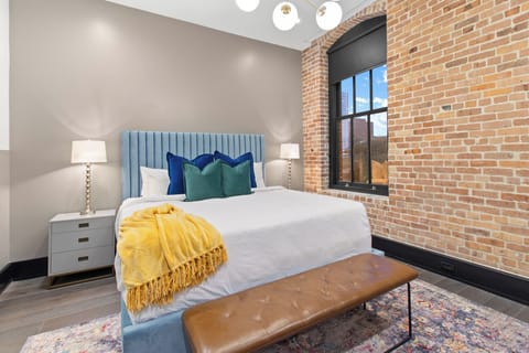 Retreat to the primary bedroom with a plush king bed, walk-in closet, blackout shades, and a smart TV. Designed for comfort and privacy, this suite is perfect for recharging after a day exploring New Orleans.