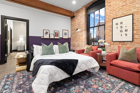 Relax in the living area with a smart TV, stylish seating, and a sleeper sofa for extra guests. Perfect for families or group stays in New Orleans, this inviting space is ideal for movie nights or recharging after a day in the city.