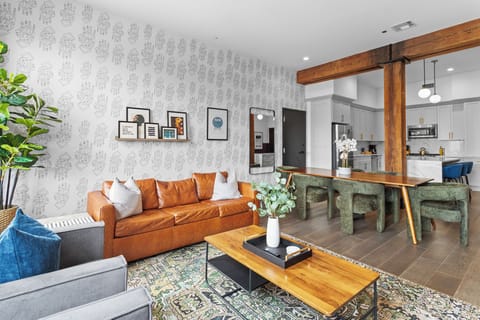 Relax in the living area with a smart TV, stylish seating, and a sleeper sofa for extra guests. Perfect for families or group stays in New Orleans, this inviting space is ideal for movie nights or recharging after a day in the city.