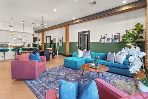 Relax in the living area with a smart TV, stylish seating, and a sleeper sofa for extra guests. Perfect for families or group stays in New Orleans, this inviting space is ideal for movie nights or recharging after a day in the city.