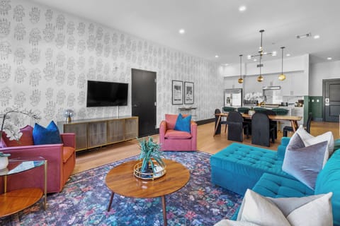 Relax in the living area with a smart TV, stylish seating, and a sleeper sofa for extra guests. Perfect for families or group stays in New Orleans, this inviting space is ideal for movie nights or recharging after a day in the city.