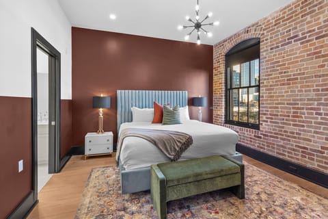 Retreat to the Primary bedroom with a plush king bed, walk-in closet, blackout shades, and a smart TV. Designed for comfort and privacy, this suite is perfect for recharging after a day exploring New Orleans.