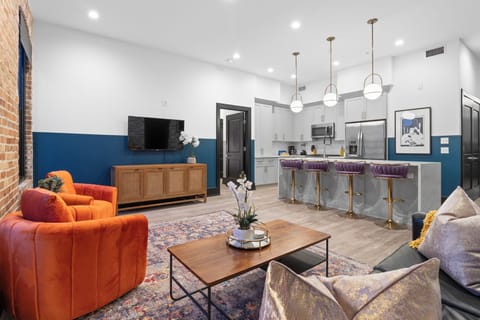 Relax in the living area with a smart TV, stylish seating, and a sleeper sofa for extra guests. Perfect for families or group stays in New Orleans, this inviting space is ideal for movie nights or recharging after a day in the city.