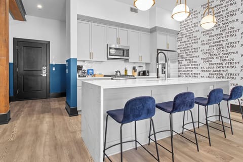 Cook or snack in style with a full kitchen featuring GE stainless appliances, cookware, and an island with bar seating. Ideal for short or extended stays, our kitchens make group travel in New Orleans easy and comfortable.