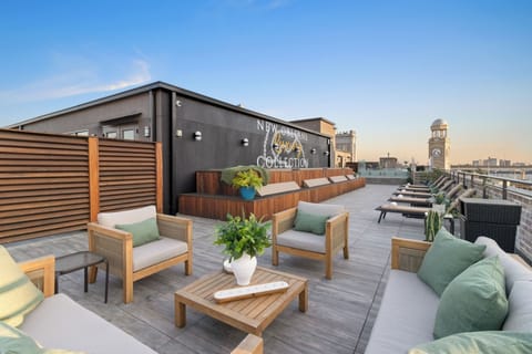 Soak up the sun or relax in the shade with plush rooftop daybeds and cozy seating at 888 Baronne. A stylish, guest-only escape overlooking Downtown New Orleans—ideal for reading, napping, or lounging between adventures.
