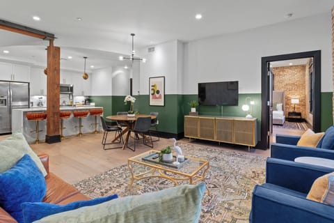 Relax in the living area with a smart TV, stylish seating, and a sleeper sofa for extra guests. Perfect for families or group stays in New Orleans, this inviting space is ideal for movie nights or recharging after a day in the city.