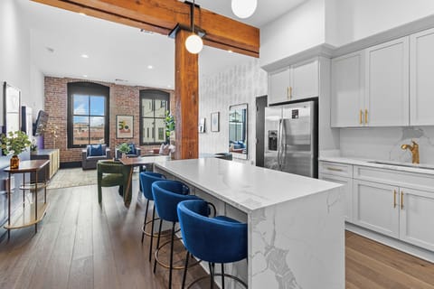 Cook or snack in style with a full kitchen featuring GE stainless appliances, cookware, and an island with bar seating. Ideal for short or extended stays, our kitchens make group travel in New Orleans easy and comfortable.