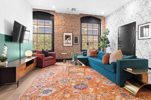 Relax in the living area with a smart TV, stylish seating, and a sleeper sofa for extra guests. Perfect for families or group stays in New Orleans, this inviting space is ideal for movie nights or recharging after a day in the city.