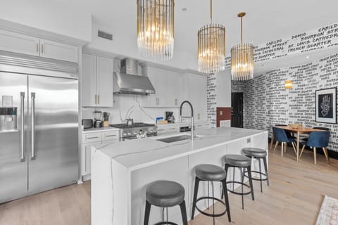 Cook or snack in style with a full kitchen featuring GE stainless appliances, cookware, and an island with bar seating. Ideal for short or extended stays, our kitchens make group travel in New Orleans easy and comfortable.