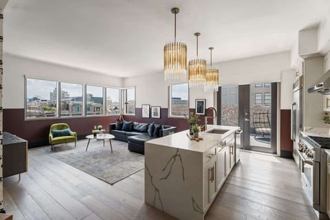 Relax in the living area with a smart TV, stylish seating, and a sleeper sofa for extra guests. Perfect for families or group stays in New Orleans, this inviting space is ideal for movie nights or recharging after a day in the city.
