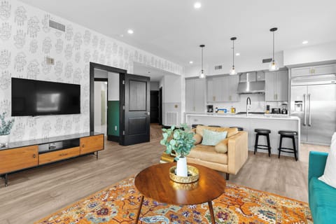 Relax in the living area with a smart TV, stylish seating, and a sleeper sofa for extra guests. Perfect for families or group stays in New Orleans, this inviting space is ideal for movie nights or recharging after a day in the city.