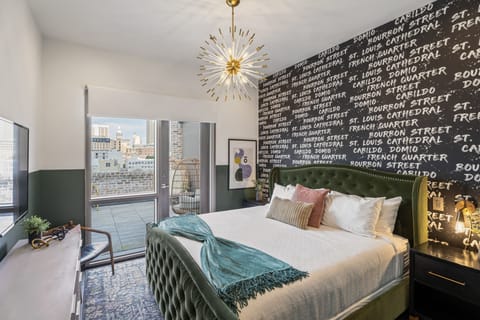 Retreat to the primary bedroom with a plush king bed, walk-in closet, blackout shades, and a smart TV. Designed for comfort and privacy, this suite is perfect for recharging after a day exploring New Orleans.