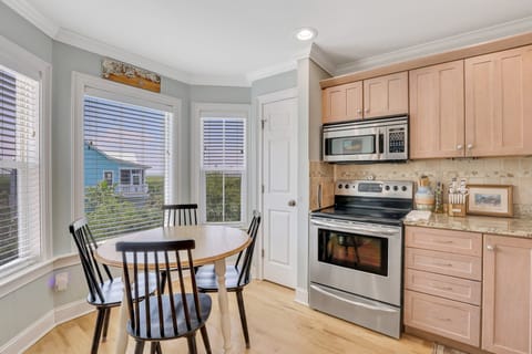 Fully stocked kitchen with sunset views.