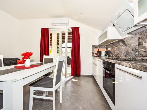 Table, Furniture, Cabinetry, Kitchen, Orange, Interior Design, Building, Wood, Floor, Flooring