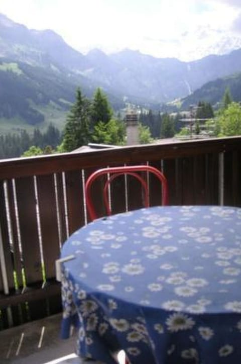 Sky, Mountain, Table, Cloud, Plant, Tree, Chair, Fence, Outdoor Furniture, Tableware