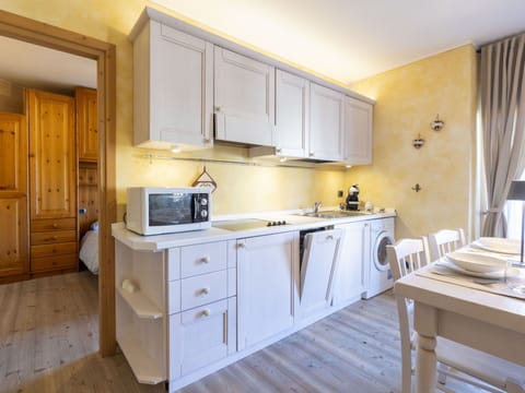 Kitchen, Furniture, Interior Design, Wood, Countertop, Kitchen Appliance, Cabinetry, Flooring, Major Appliance, Ceiling