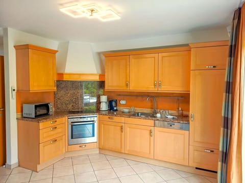 Cabinetry, Countertop, Property, Furniture, Kitchen Appliance, Kitchen, Home Appliance, Kitchen Stove, Wood, Interior Design