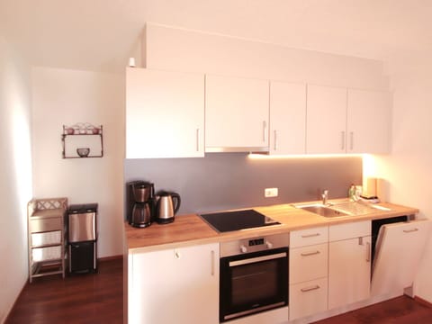 Interior Design, Kitchen Appliance, Kitchen, Furniture, Countertop, Cabinetry, Wood, Major Appliance, Flooring, Room