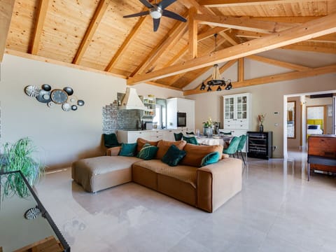 Furniture, Interior Design, Flooring, Floor, Couch, Ceiling, Wood, Living Room, Chair, Light Fixture