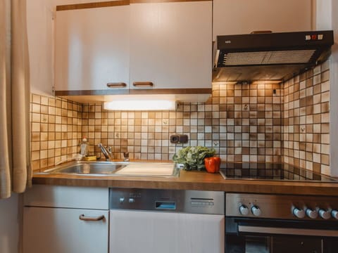 Kitchen, Countertop, Kitchen Appliance, Interior Design, Major Appliance, Flooring, Cabinetry, Plumbing Fixture, Tap