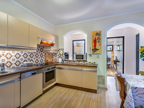 Flooring, Kitchen, Interior Design, Floor, Ceiling, Kitchen Appliance, Countertop, Major Appliance, Room, Cabinetry