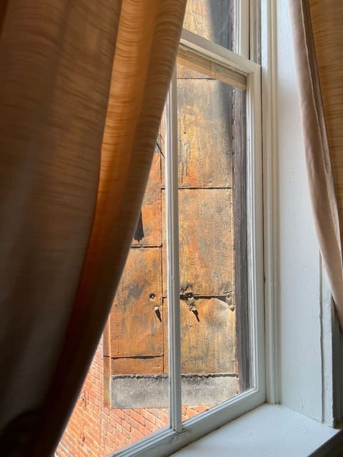 This suite is housed on the second floor of the First Mississippi Bank Building, ca. 1898. Shown here are the metal shutters at the back of the building.