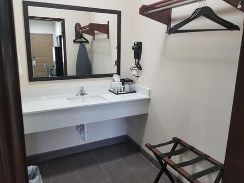 Refresh easily at the bright vanity with convenient toiletries.