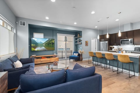 Bright, open-concept living space with modern finishes and cozy seating.