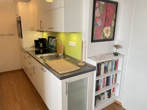 Cabinetry, Kitchen Sink, Sink, Furniture, Tap, Countertop, Picture Frame, Kitchen Stove, Kitchen Appliance, Interior Design