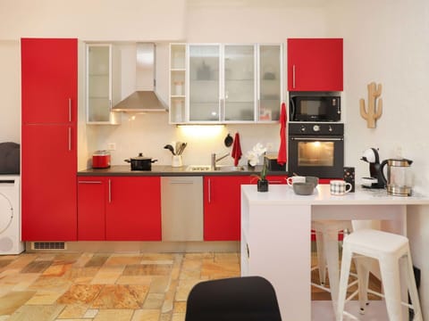 Cabinetry, Furniture, Countertop, Kitchen Stove, Kitchen, Interior Design, Wood, Orange, Chair, Home Appliance