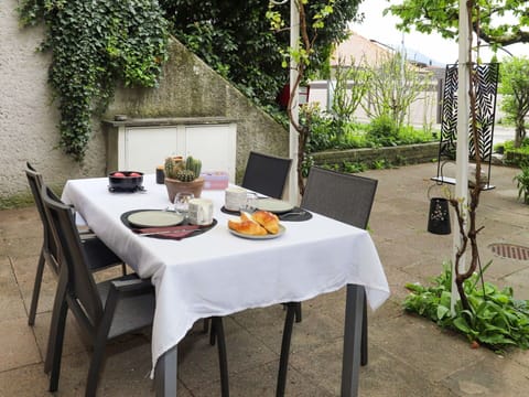Food, Table, Plant, Tableware, Furniture, Property, Outdoor Table, Outdoor Furniture, Chair, Interior Design