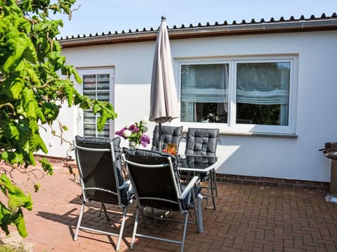 Plant, Window, Property, Building, Flowerpot, Chair, Houseplant, Shade, Outdoor Furniture, Residential Area