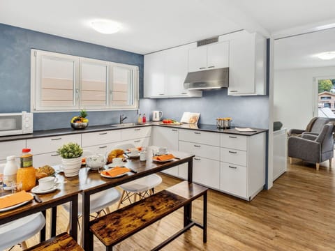 Countertop, Cabinetry, Property, Furniture, Food, Table, Kitchen Stove, Kitchen, Interior Design, Orange