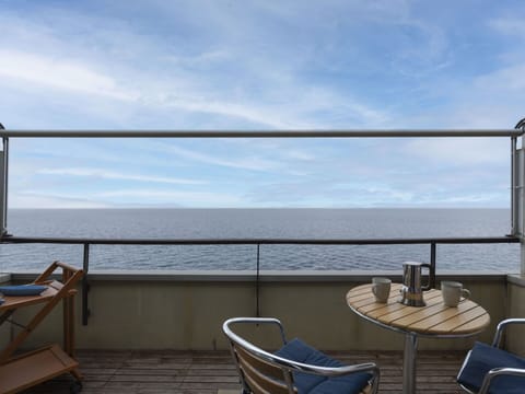 Sky, Cloud, Water, Property, Furniture, Azure, Chair, Outdoor Furniture, Shade, Wood