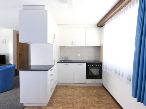 Cabinetry, Property, Furniture, Building, Countertop, Kitchen Stove, Curtain, House, Kitchen Appliance, Wood