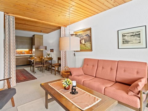 Furniture, Property, Couch, Table, Wood, Interior Design, Orange, Lighting, Living Room, Flooring