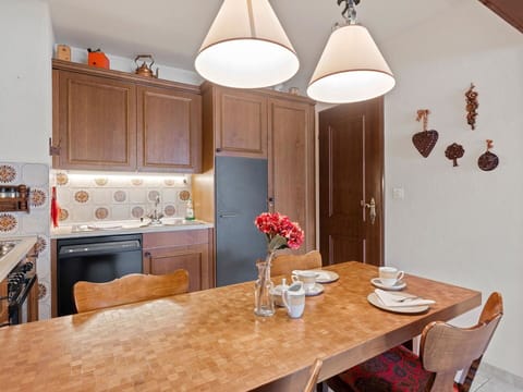 Table, Furniture, Property, Cabinetry, Countertop, Chair, Wood, Interior Design, Lighting, Flooring