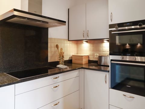 Cabinetry, Countertop, Furniture, Property, Kitchen, Kitchen Appliance, Kitchen Stove, Drawer, Wood, Interior Design