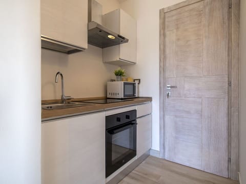 Cabinetry, Countertop, Sink, Kitchen Stove, Building, Kitchen Sink, Kitchen Appliance, Wood, Interior Design, Home Appliance